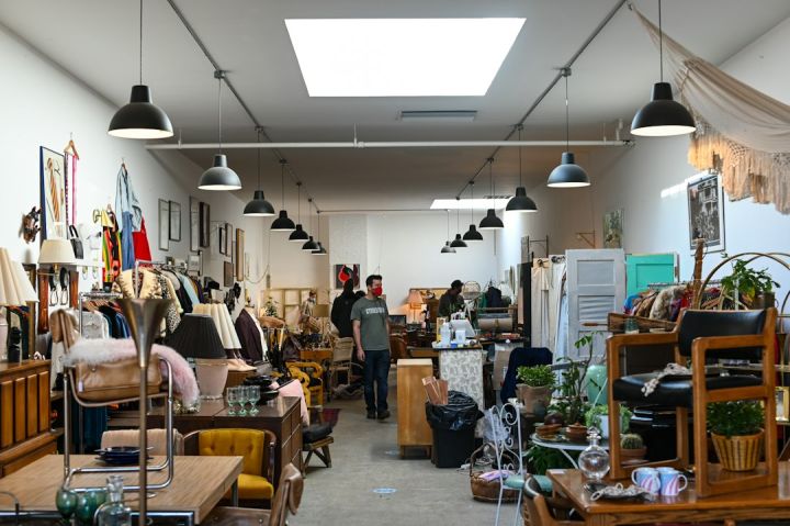 Thrift Store - people sitting on chairs inside room