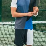 Sportswear - Man Wearing Blue and White Crew-neck Shirt and Shorts