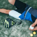 Sportswear - Man Lying Beside on Green Tennis Balls