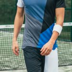 Sportswear - Man Wearing Blue, Gray, and Black Crew-neck Shirt