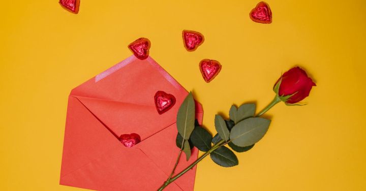 Gift Ideas - Red Envelope and Red Rose On Yellow Background