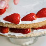 Foodie Favorites - Person Holding Strawberry Cake on White Ceramic Plate