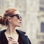 Shopping - Shallow Focus Photography of Woman Holding Assorted-color Paper Bags