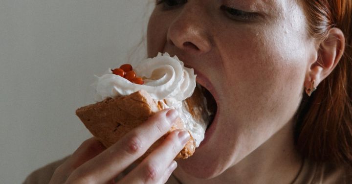 Foodie Favorites - Woman Eating Baked Good Dessert