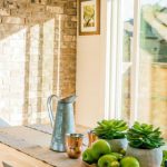 Home Decor - Black Kettle Beside Condiment Shakers and Green Fruits and Plants on Tray on Brown Wooden Table