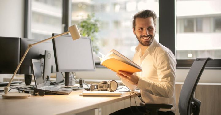 Tech Gadgets - Photo of Man Holding a Book