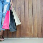 Shopping - Woman Wearing Distressed Jeans